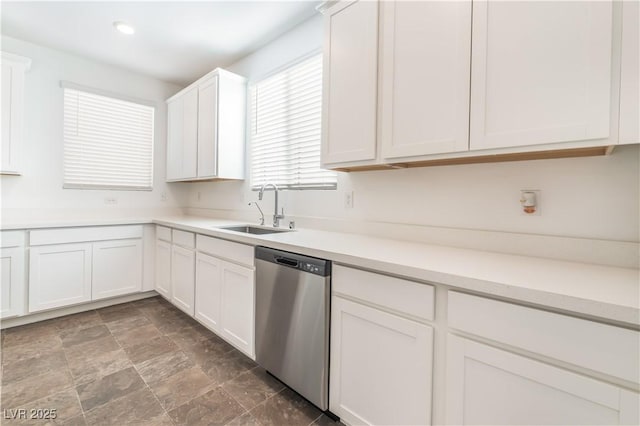 2767 Lindsey Springs St, Las Vegas, NV 89142 - kitchen with dishwasher, white cabinets, light countertops, stone finish floors, and recessed lighting