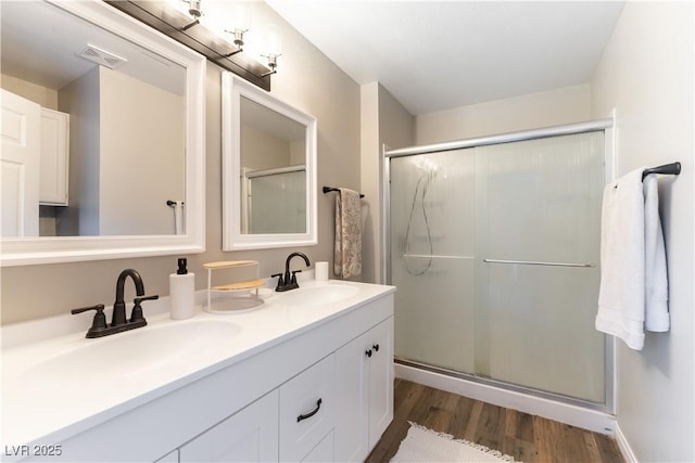 100 Walker Way, Boulder City, NV 89005 - bathroom featuring a shower stall, wood finished floors, and double vanity