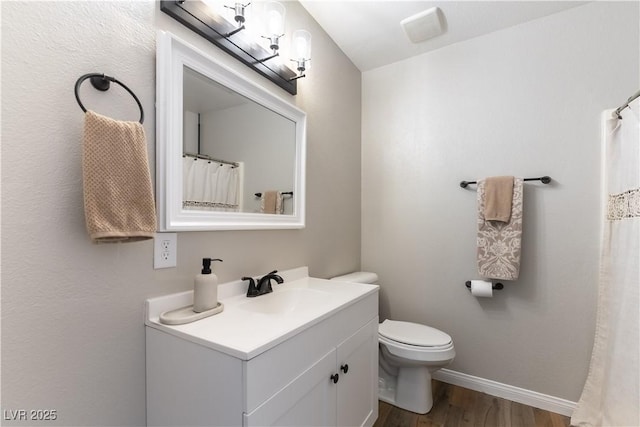 100 Walker Way, Boulder City, NV 89005 - bathroom with wood finished floors, vanity, toilet, and baseboards