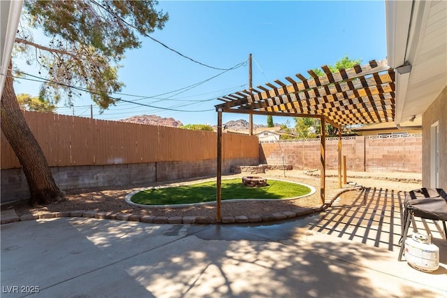 100 Walker Way, Boulder City, NV 89005 - view of patio / terrace with a fenced backyard, a fire pit, and a pergola