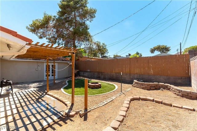 100 Walker Way, Boulder City, NV 89005 - fenced backyard featuring an outdoor fire pit, a patio, and a pergola