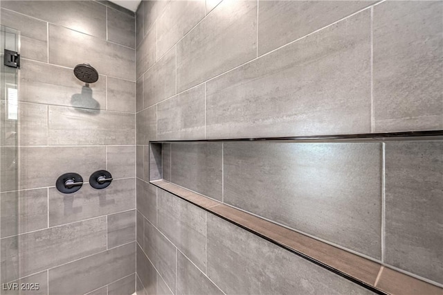 bathroom view of tiled shower