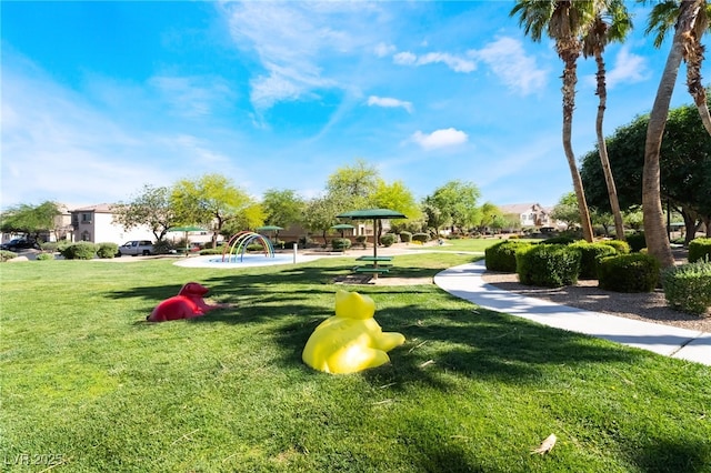 view of home's community with a yard