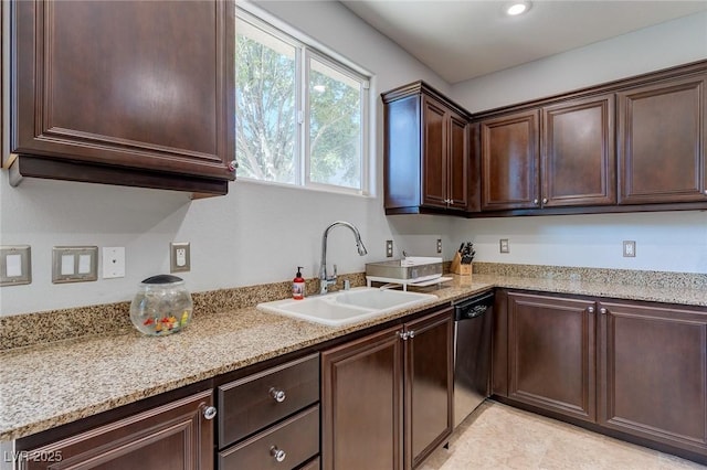 9780 Ziegler Ave, Las Vegas, NV 89148 - kitchen featuring a sink, dishwasher, dark brown cabinetry, and light stone countertops