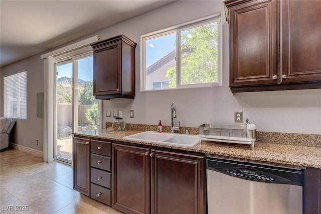 9780 Ziegler Ave, Las Vegas, NV 89148 - kitchen with dishwasher, a sink, dark brown cabinetry, baseboards, and light tile patterned floors