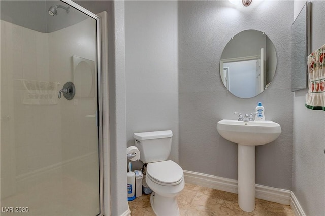 9780 Ziegler Ave, Las Vegas, NV 89148 - full bathroom with a shower stall, toilet, and baseboards