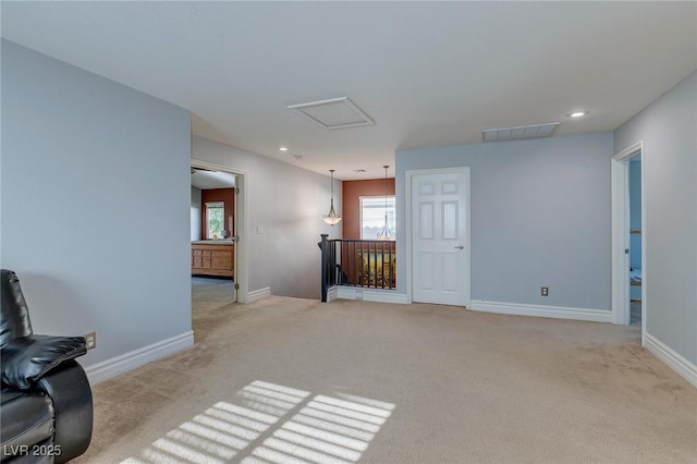 9780 Ziegler Ave, Las Vegas, NV 89148 - unfurnished living room featuring carpet floors, baseboards, recessed lighting, and attic access