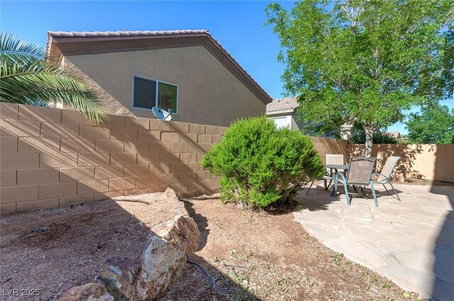 9780 Ziegler Ave, Las Vegas, NV 89148 - fenced backyard with a patio and outdoor dining space