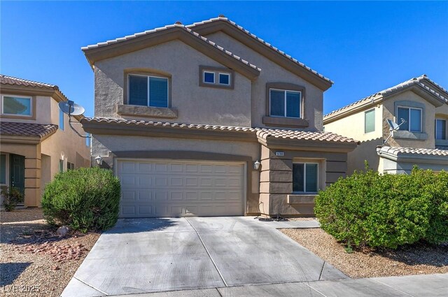 9780 Ziegler Ave, Las Vegas, NV 89148 - mediterranean / spanish-style home featuring a garage, concrete driveway, stucco siding, and a tile roof