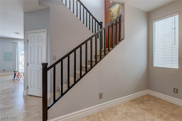 9780 Ziegler Ave, Las Vegas, NV 89148 - stairway with baseboards and tile patterned floors