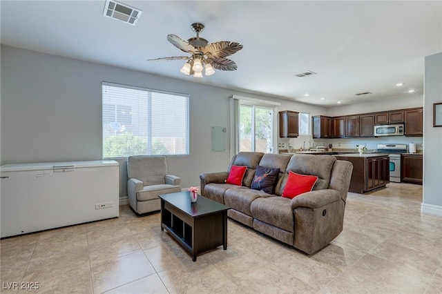 9780 Ziegler Ave, Las Vegas, NV 89148 - living room with recessed lighting, ceiling fan, light tile patterned floors, and baseboards
