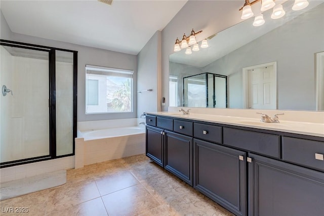 9780 Ziegler Ave, Las Vegas, NV 89148 - full bathroom with double vanity, a shower stall, a garden tub, tile patterned flooring, and lofted ceiling