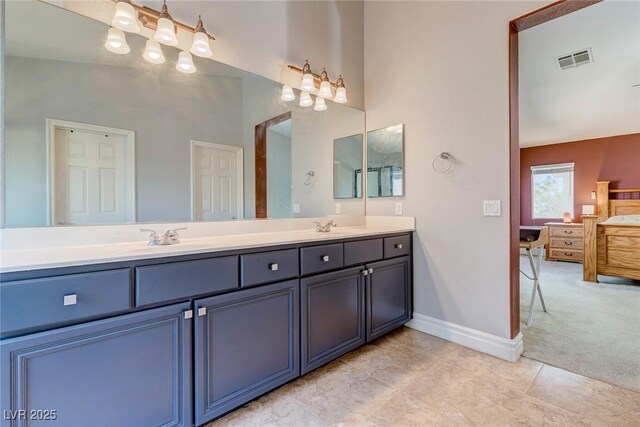 9780 Ziegler Ave, Las Vegas, NV 89148 - bathroom featuring double vanity, baseboards, and tile patterned floors