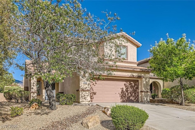 2728 Holmfault St, Henderson, NV 89044 - view of front of property featuring a garage, concrete driveway, and stucco siding
