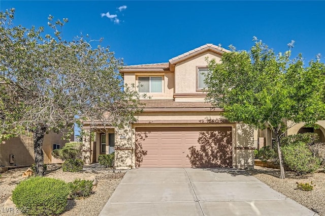 2728 Holmfault St, Henderson, NV 89044 - view of front of property with an attached garage, concrete driveway, stucco siding, and a tiled roof