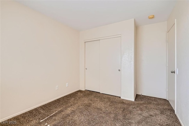 2728 Holmfault St, Henderson, NV 89044 - unfurnished bedroom featuring dark colored carpet, a closet, and baseboards
