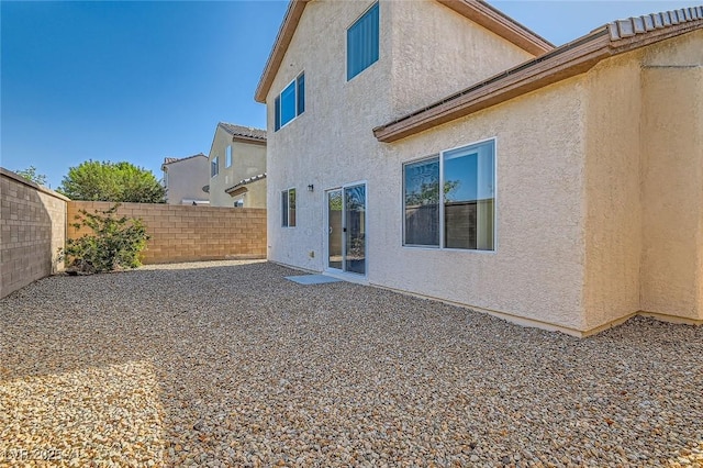 2728 Holmfault St, Henderson, NV 89044 - back of property with stucco siding and a fenced backyard