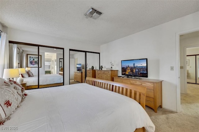 8388 Brad Oaks Cir, Las Vegas, NV 89123 - bedroom with light carpet, multiple closets, and a textured ceiling