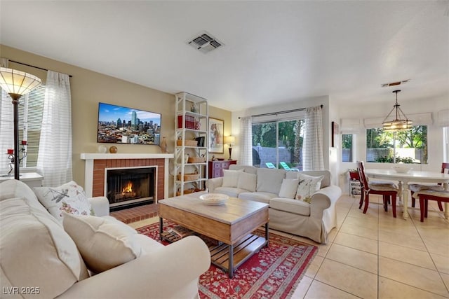 8388 Brad Oaks Cir, Las Vegas, NV 89123 - living area featuring light tile patterned flooring and a brick fireplace