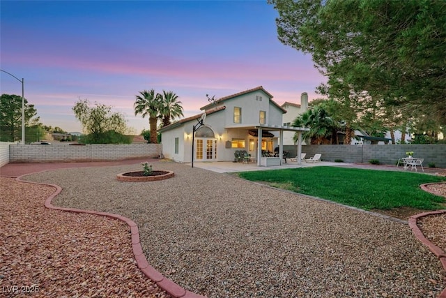 8388 Brad Oaks Cir, Las Vegas, NV 89123 - back of house with french doors, a patio, and stucco siding