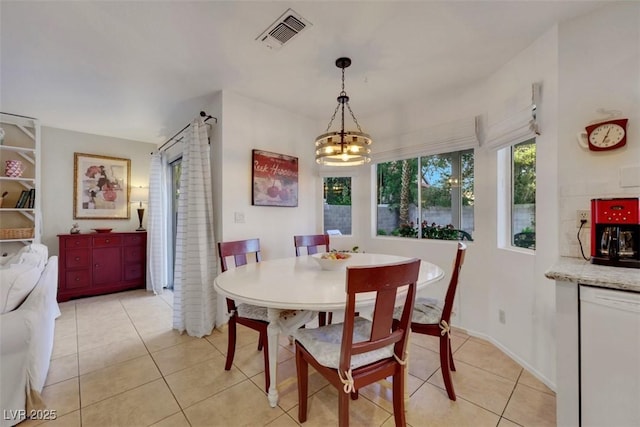 8388 Brad Oaks Cir, Las Vegas, NV 89123 - dining area with a chandelier and light tile patterned floors