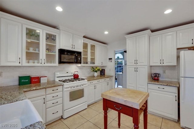 8388 Brad Oaks Cir, Las Vegas, NV 89123 - kitchen featuring white appliances, backsplash, white cabinets, and recessed lighting
