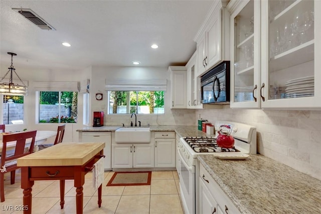 8388 Brad Oaks Cir, Las Vegas, NV 89123 - kitchen with white appliances, a sink, white cabinets, glass insert cabinets, and light stone countertops