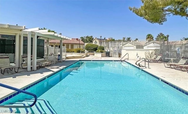 8388 Brad Oaks Cir, Las Vegas, NV 89123 - community pool with a patio, fence, and a residential view