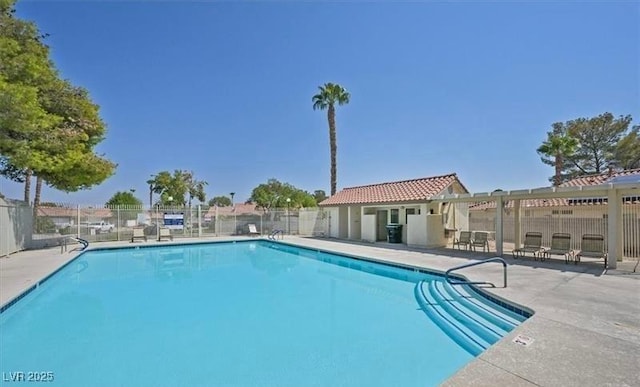 8388 Brad Oaks Cir, Las Vegas, NV 89123 - community pool with fence and a patio