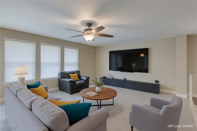 9469 Coral Shine Ct, Las Vegas, NV 89123 - living room with light carpet, a ceiling fan, and baseboards