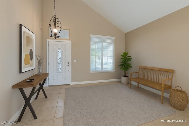 9469 Coral Shine Ct, Las Vegas, NV 89123 - foyer entrance featuring light tile patterned flooring, high vaulted ceiling, and baseboards