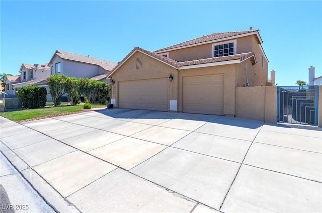 9469 Coral Shine Ct, Las Vegas, NV 89123 - view of front of property featuring stucco siding, driveway, a garage, a tile roof, and a gate
