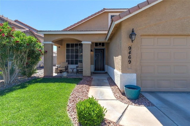 9469 Coral Shine Ct, Las Vegas, NV 89123 - entrance to property with an attached garage, stucco siding, and a yard
