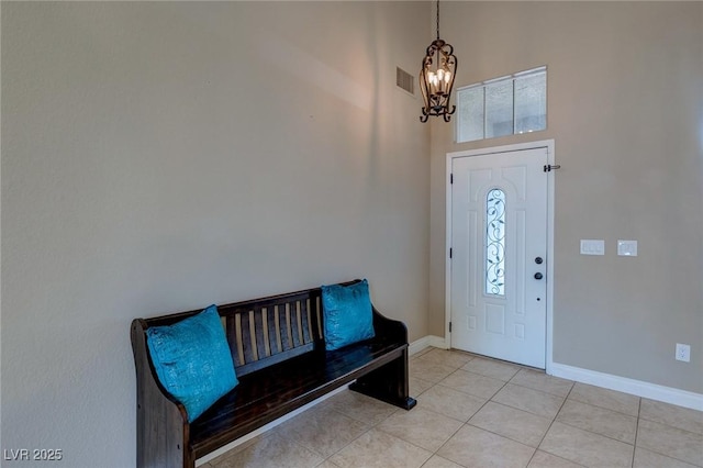 9469 Coral Shine Ct, Las Vegas, NV 89123 - foyer entrance with a chandelier, baseboards, light tile patterned floors, and a towering ceiling