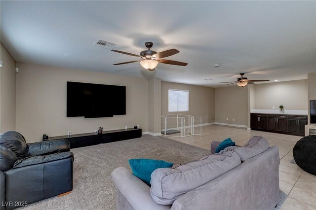 9469 Coral Shine Ct, Las Vegas, NV 89123 - living area with a ceiling fan, light tile patterned flooring, and baseboards