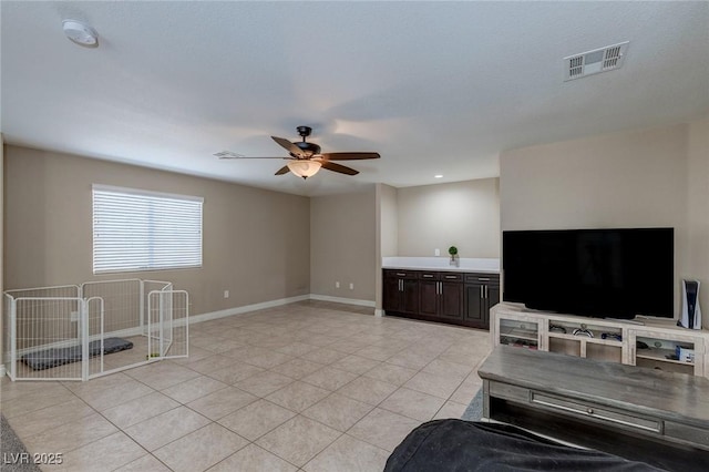 9469 Coral Shine Ct, Las Vegas, NV 89123 - unfurnished living room with a ceiling fan, light tile patterned floors, and baseboards