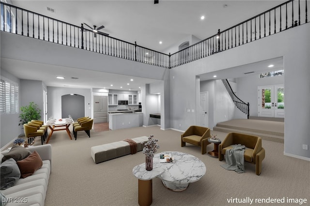 8809 Barium Rock Ave, Las Vegas, NV 89143 - living area featuring light carpet, french doors, stairway, a towering ceiling, and recessed lighting