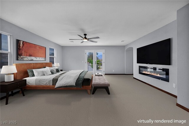 8809 Barium Rock Ave, Las Vegas, NV 89143 - bedroom with access to outside, a glass covered fireplace, carpet flooring, a ceiling fan, and french doors