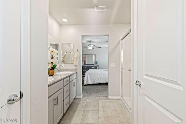 full bathroom with connected bathroom, a stall shower, a ceiling fan, and double vanity