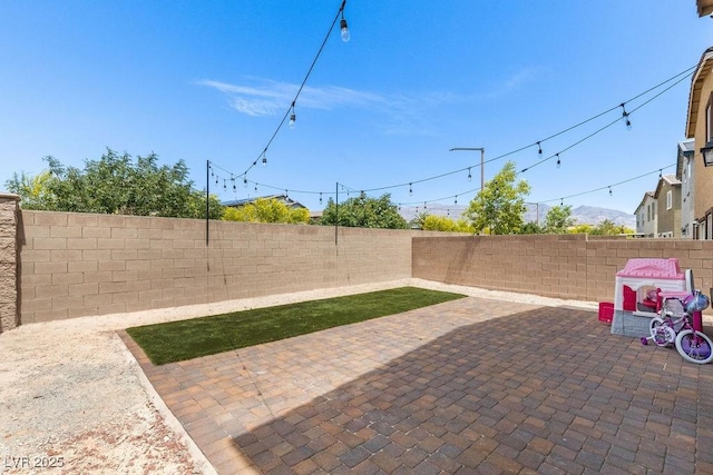 view of patio with a fenced backyard