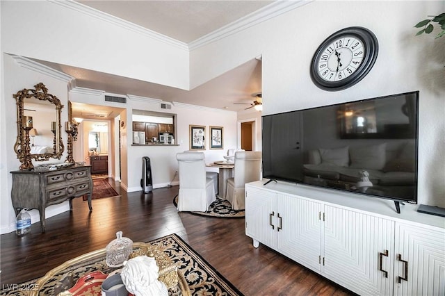 8101 W Flamingo Rd Unit 2006, Las Vegas, NV 89147 - living room with crown molding, dark wood-style floors, baseboards, and a ceiling fan