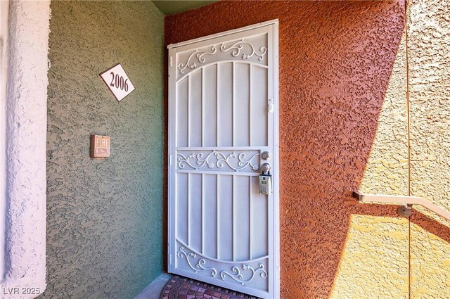 8101 W Flamingo Rd Unit 2006, Las Vegas, NV 89147 - doorway to property with stucco siding