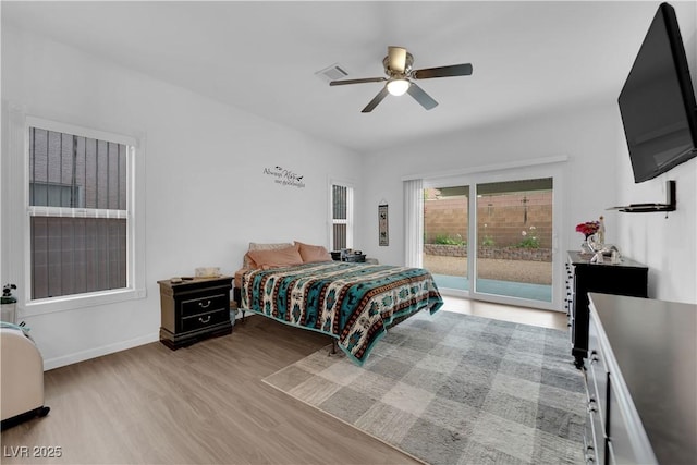 1893 Donnington Ct, Las Vegas, NV 89123 - bedroom featuring access to exterior, wood finished floors, a ceiling fan, and baseboards