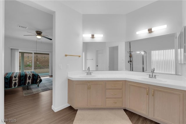 1893 Donnington Ct, Las Vegas, NV 89123 - ensuite bathroom with a ceiling fan, wood finished floors, double vanity, and baseboards