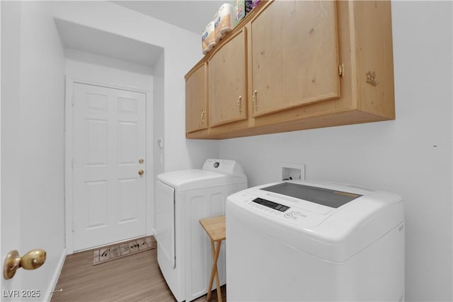 1893 Donnington Ct, Las Vegas, NV 89123 - laundry area with separate washer and dryer, cabinet space, light wood-style floors, and baseboards