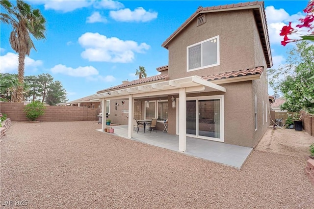 1893 Donnington Ct, Las Vegas, NV 89123 - back of property with a tiled roof, stucco siding, a fenced backyard, and a patio area