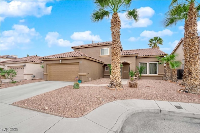 1893 Donnington Ct, Las Vegas, NV 89123 - mediterranean / spanish home featuring stucco siding, a tiled roof, concrete driveway, and a garage