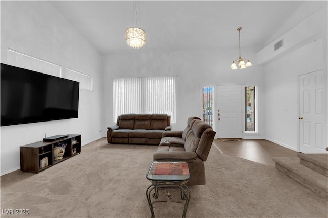 1893 Donnington Ct, Las Vegas, NV 89123 - living area with a chandelier, carpet, and high vaulted ceiling