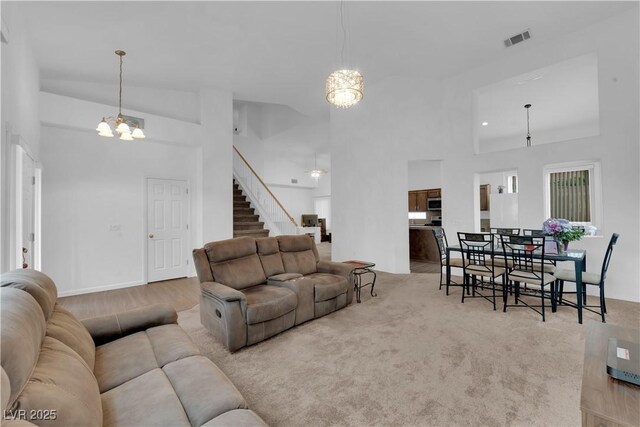 1893 Donnington Ct, Las Vegas, NV 89123 - living area featuring a chandelier, stairway, and a towering ceiling