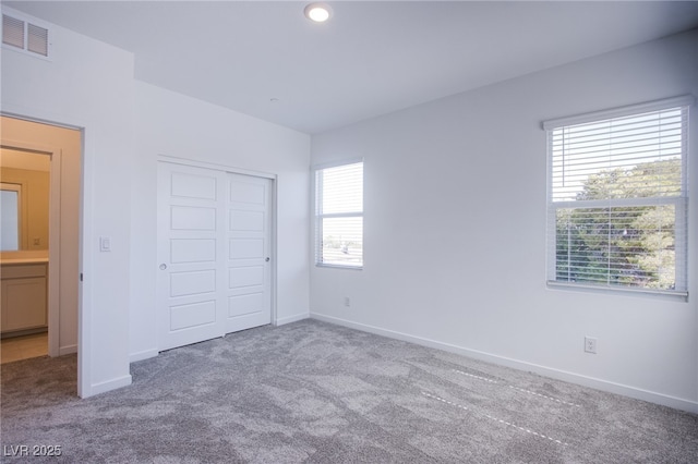 145 Aqua Commons Ln, Henderson, NV 89015 - unfurnished bedroom featuring carpet floors, baseboards, a closet, and recessed lighting
